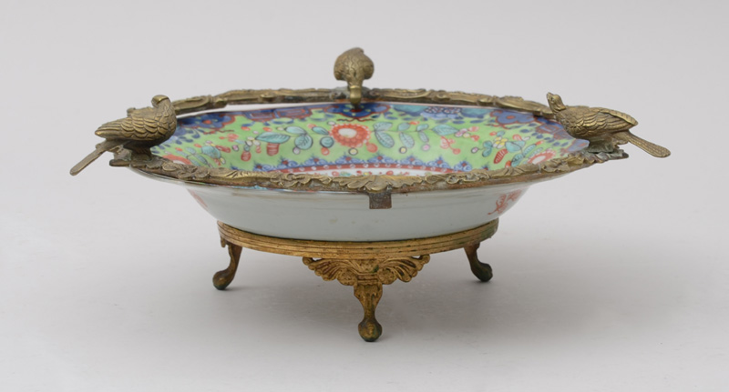 Appraisal: GILT-METAL-MOUNTED CHINESE PORCELAIN OCTAGONAL SOUP DISH The bowl with pagodas