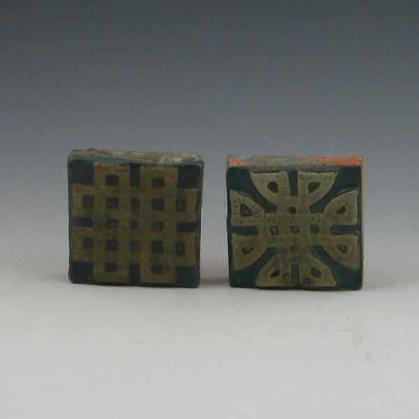 Appraisal: Two Grueby attribution Arts Crafts tiles with matte glaze Unmarked