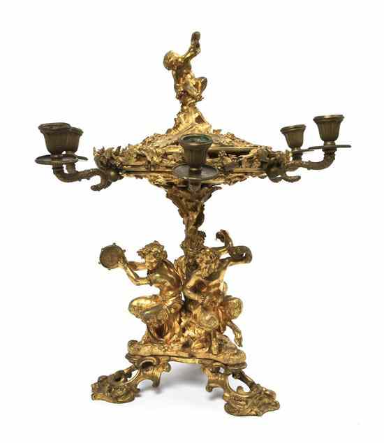 Appraisal: A Continental Gilt Bronze Figural Centerpiece the circular bowl with