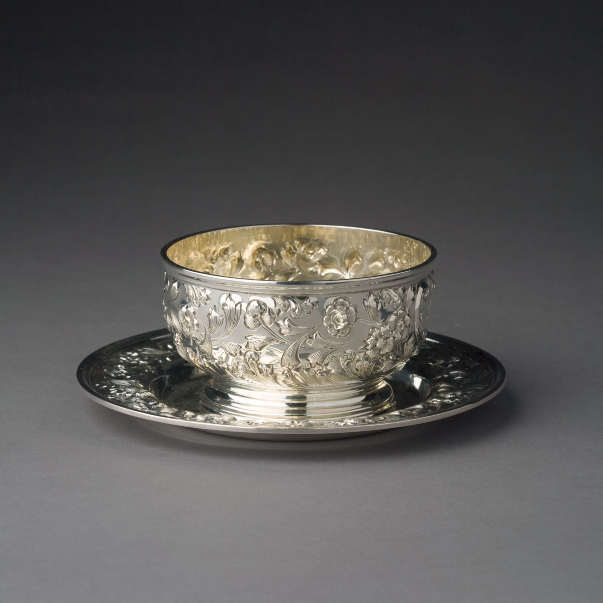 Appraisal: AMERICAN REPOUSSE SILVER CHILDREN'S CEREAL BOWL AND LINER BIGELOW KENNARD