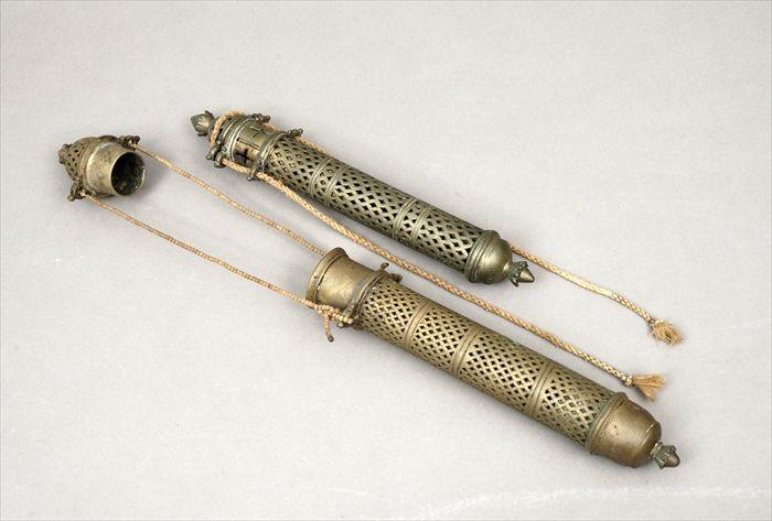 Appraisal: Two Near Eastern Pierced Brass Scroll Holders and in