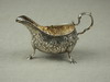 Appraisal: GRAVY BOAT - Irish hallmarked silver floral repousse gravy boat