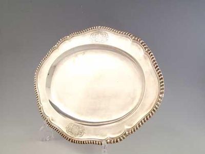 Appraisal: An early George III shaped oval meat dish with a