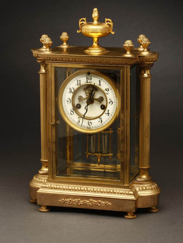 Appraisal: A Waterbury bronze crystal regulator clock A Waterbury bronze crystal