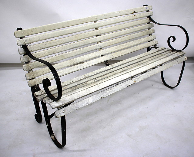 Appraisal: AN OLD WROUGHT IRON GARDEN BENCH painted in black and