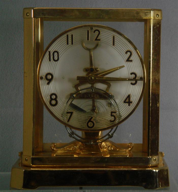 Appraisal: United Clock Corp Unitime electromechanical clock rising case h Estimate