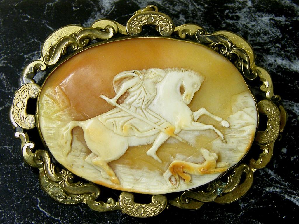 Appraisal: Victorian oval cameo brooch carved in relief with a huntsman