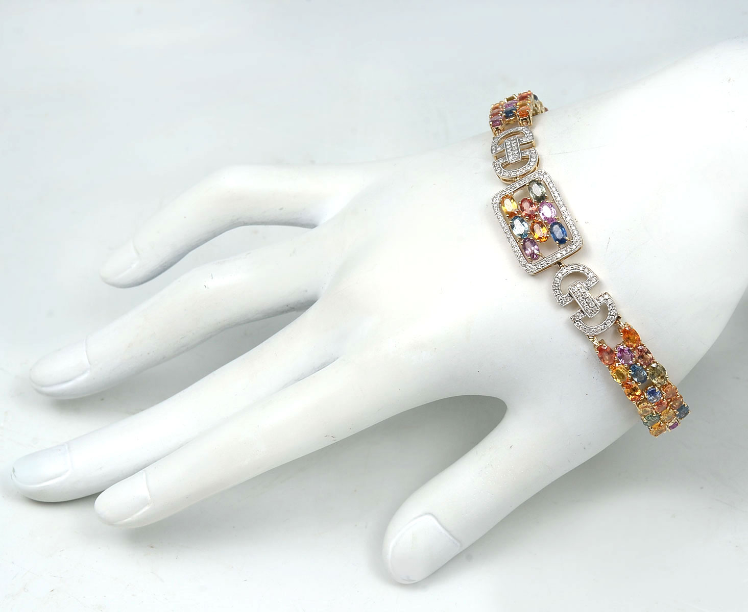 Appraisal: K MULTI-COLOR CTW SAPPHIRE DIAMOND BRACELET oval cut multi-color sapphires