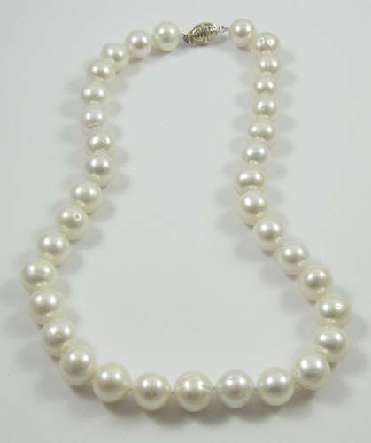 Appraisal: PRINCESS LENGTH PEARL NECKLACE strung with white pearls Necklace length