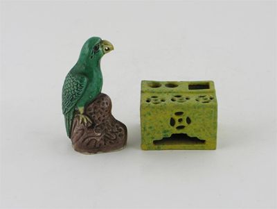 Appraisal: A small enamel on biscuit model of a green parrot