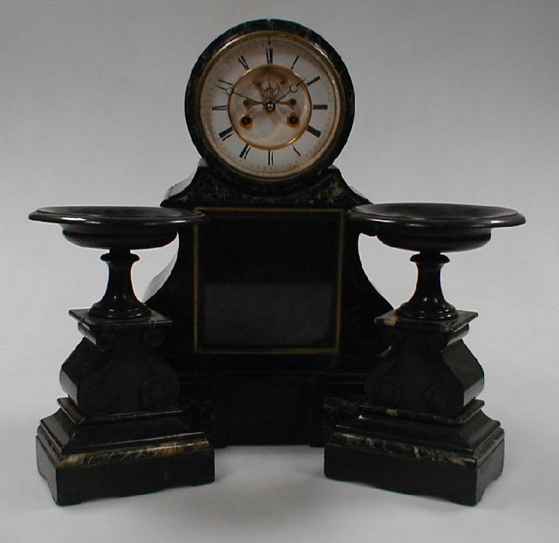 Appraisal: A thC black slate and marble clock garniture the two-part