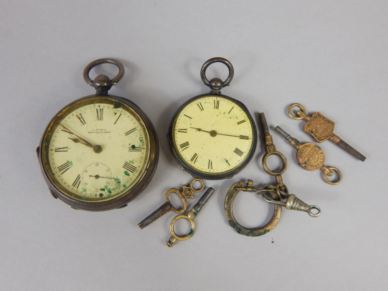 Appraisal: Two silver pocket watches and advertising keys enclosed in a