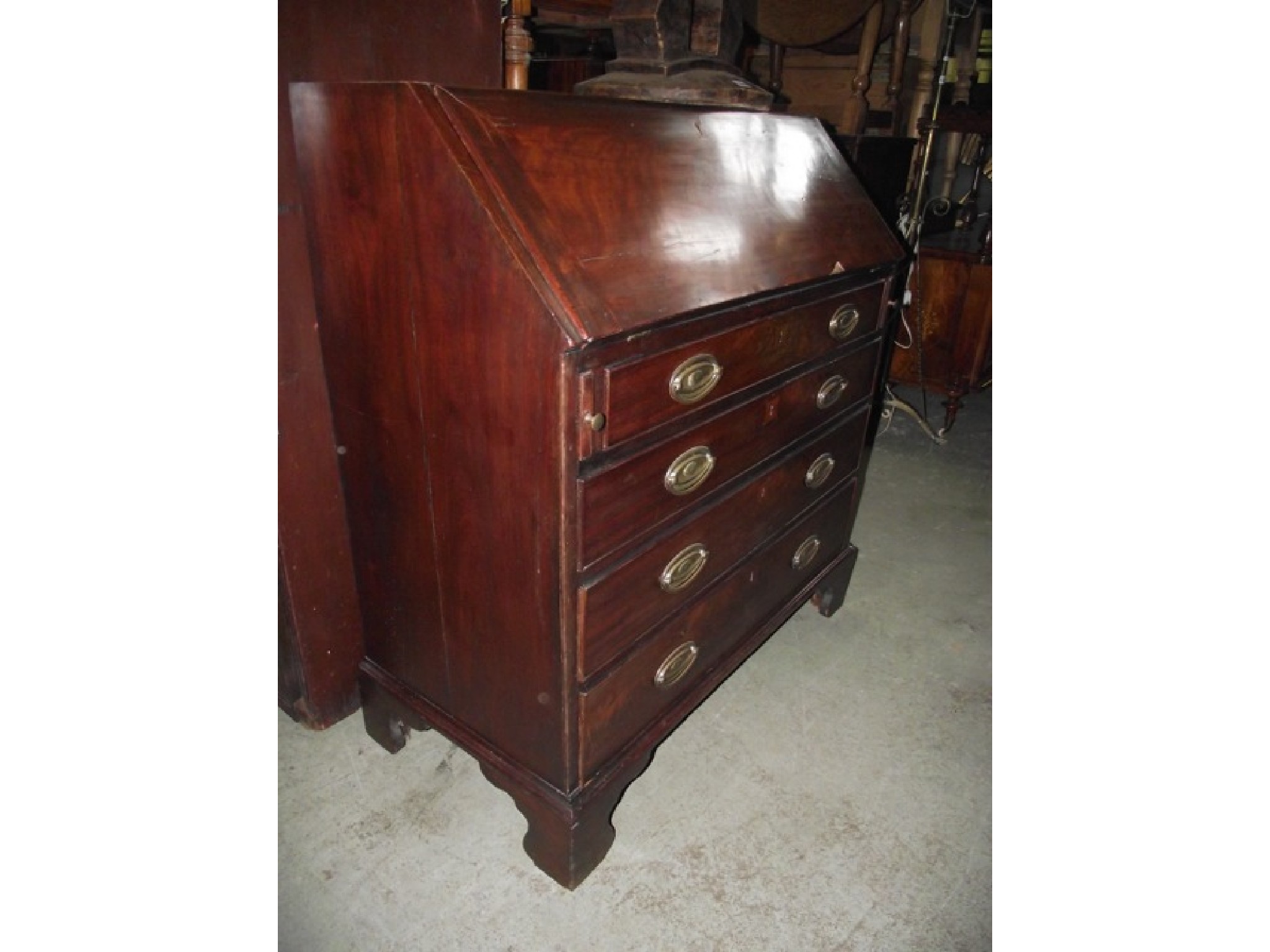 Appraisal: A Georgian mahogany writing bureau the fall flap enclosing a