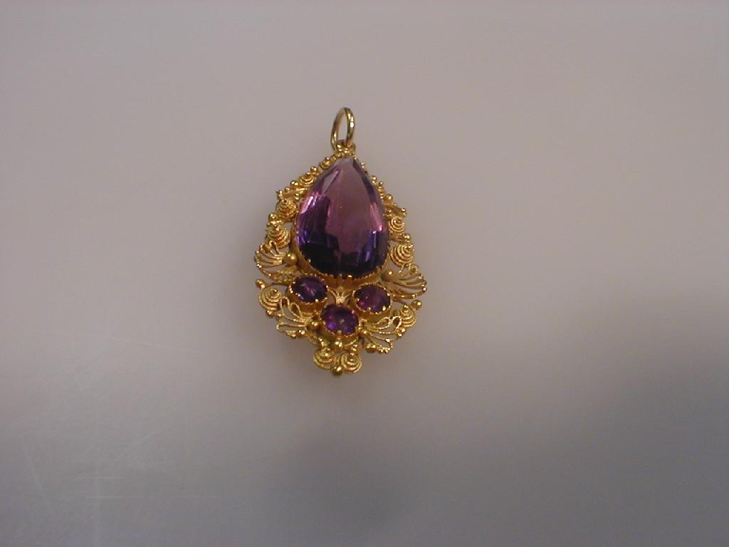 Appraisal: A tear drop shaped amethyst set pendant filigree yellow metal