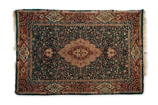 Appraisal: ORIENTAL RUG Indo-Kashan Green ground with an ivory medallion '