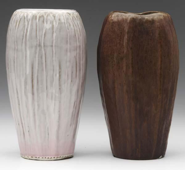 Appraisal: AREQUIPA Two four-sided vases carved with full-height leaves covered in