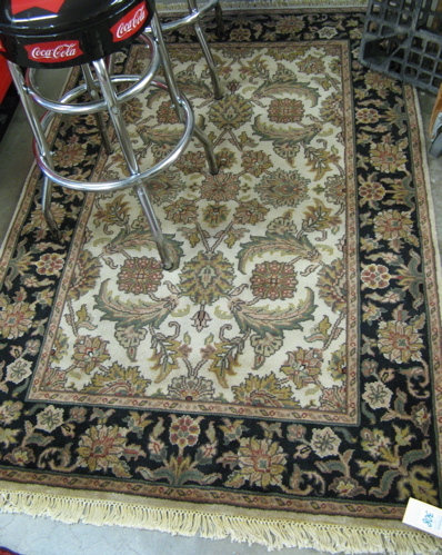 Appraisal: HAND KNOTTED ORIENTAL AREA RUG Indo-Persian overall floral decoration on