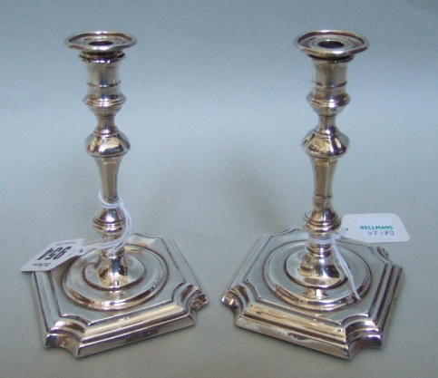 Appraisal: A pair of silver miniature candlesticks with knoped stems and