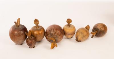 Appraisal: Seven treen pieces of fruit each with metal stem and