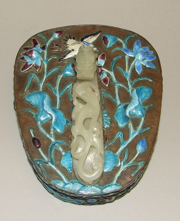 Appraisal: Oval box features applied enamel decoration with flower and crane