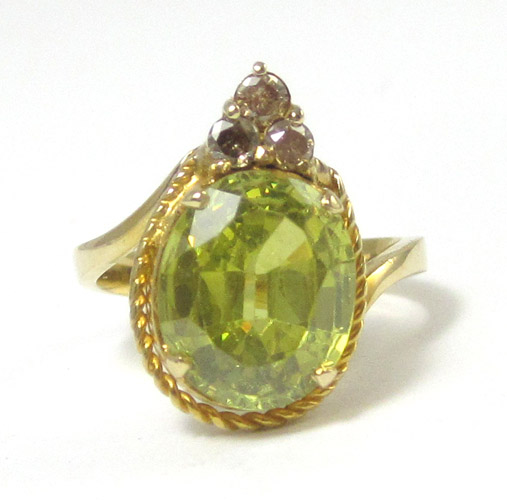 Appraisal: GREEN CUBIC ZIRCONIA AND DIAMOND RING k yellow gold ring