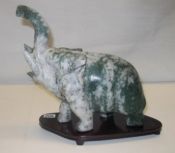 Appraisal: A SOAPSTONE FIGURAL ELEPHANT AND CLUSTERS OF GRAPES The figure