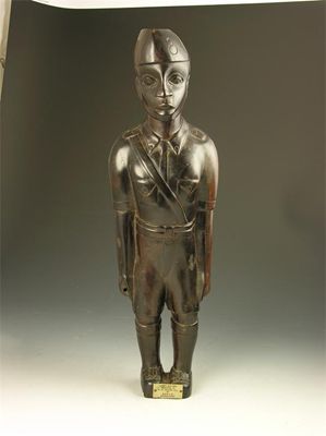 Appraisal: An African carved hardwood figure of an officer the base