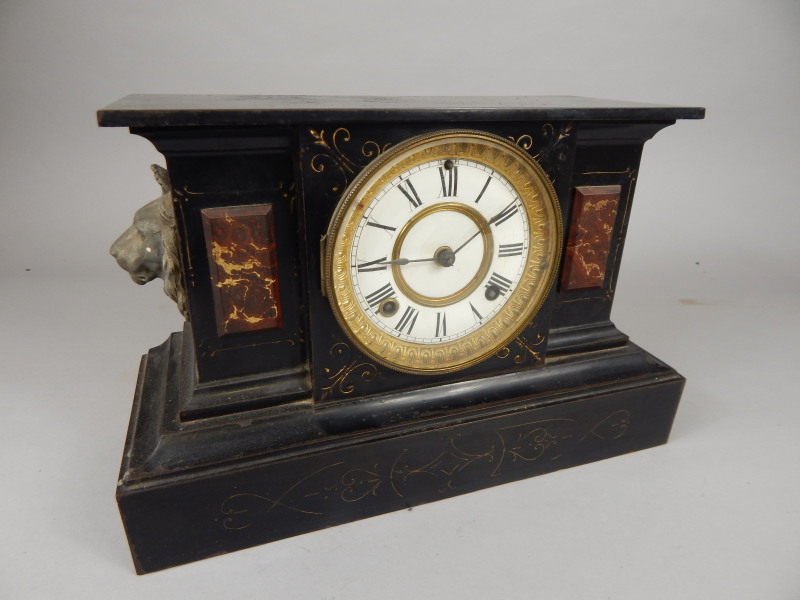 Appraisal: A French marble mantel clock with enamel dial and parcel