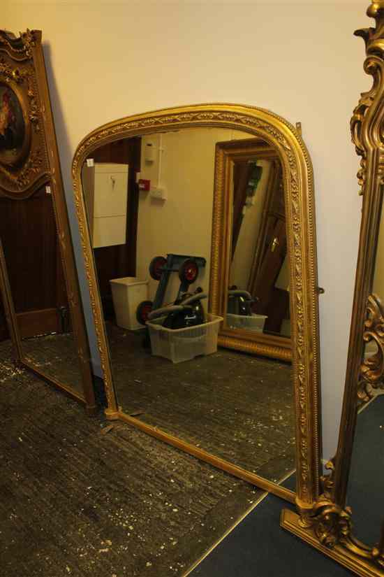 Appraisal: A Victorian carved giltwood and gesso overmantel mirror with bow