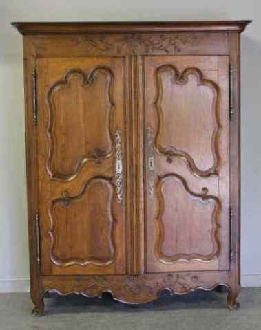 Appraisal: Antique French Door Armoire Oak with basket of flowers motif