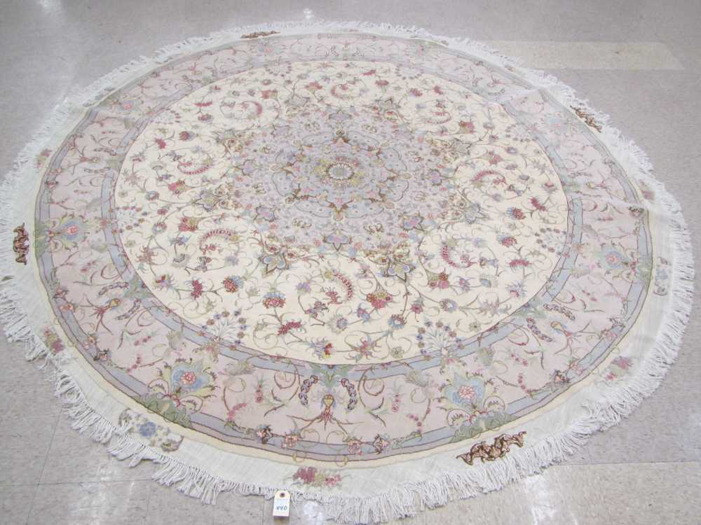 Appraisal: A CONTEMPORARY ROUND PERSIAN WOOL AND SILK CARPET hand knotted