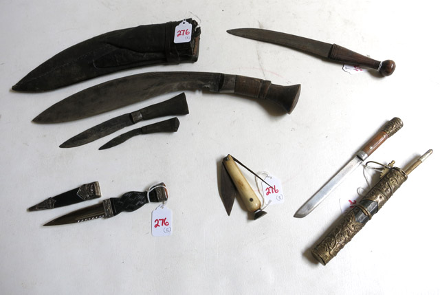 Appraisal: COLLECTION OF FIVE KNIVES Gurkha type Kukuri knife in leather