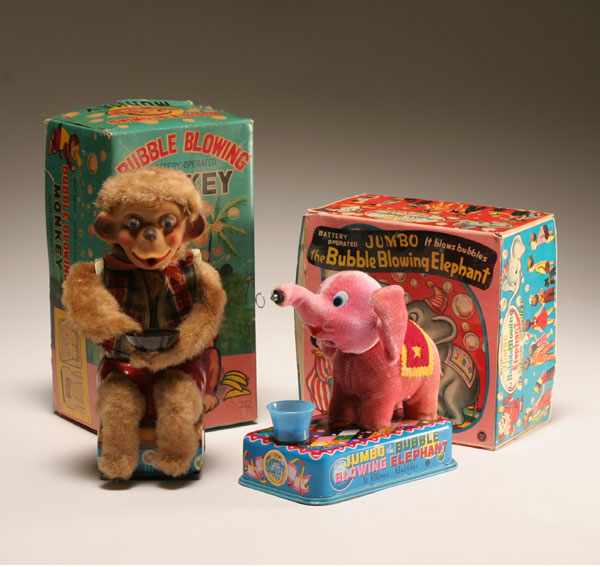 Appraisal: Vintage elephant and monkey battery operated bubble blowers E T