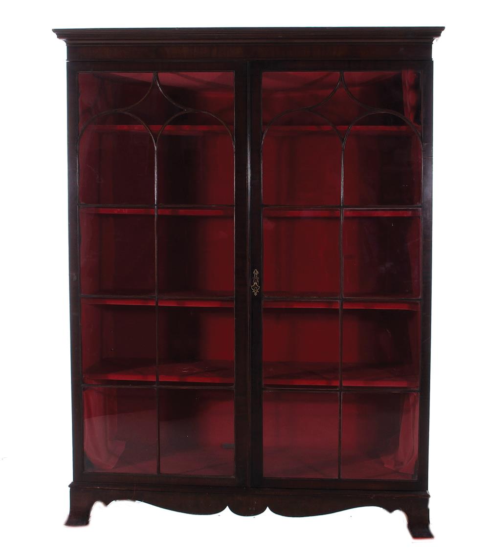 Appraisal: Sheraton style mahogany curio bookcase circa molded crown over Gothic