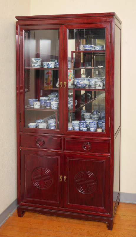 Appraisal: ORIENTAL MOTIF CURIO DISPLAY CABINET glass doors interior with mirrored