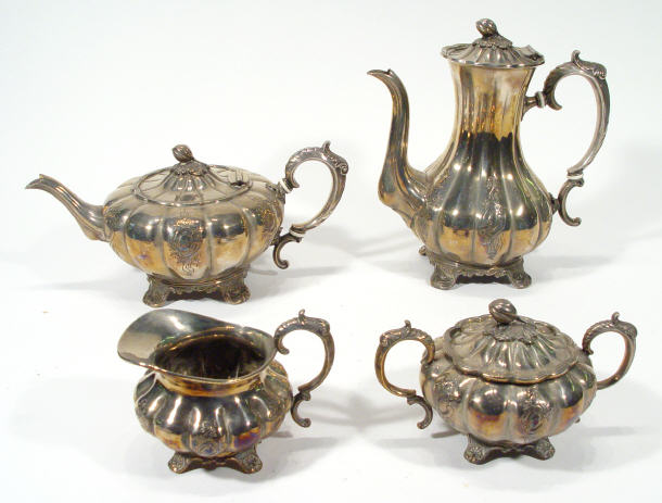 Appraisal: Fluted Victorian four piece silver plated teaset with chased decoration