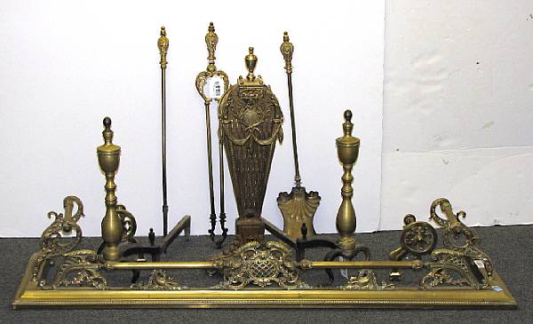 Appraisal: An assembled group of cast brass fireplace accessories th th