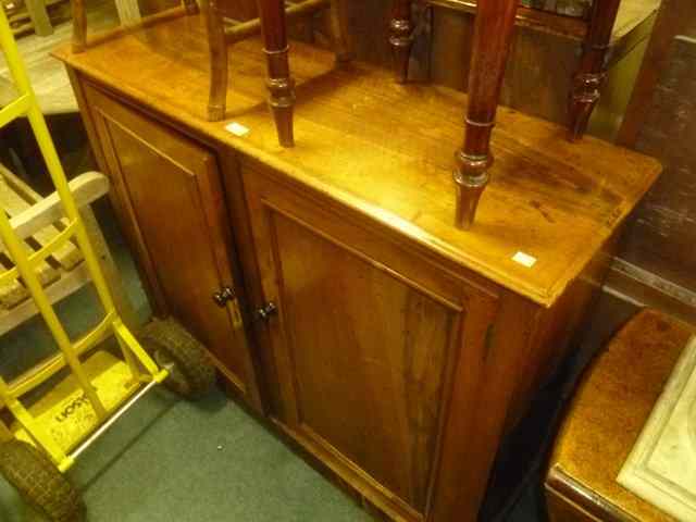 Appraisal: A VICTORIAN MAHOGANY SIDE CUPBOARD enclosed by two panel doors