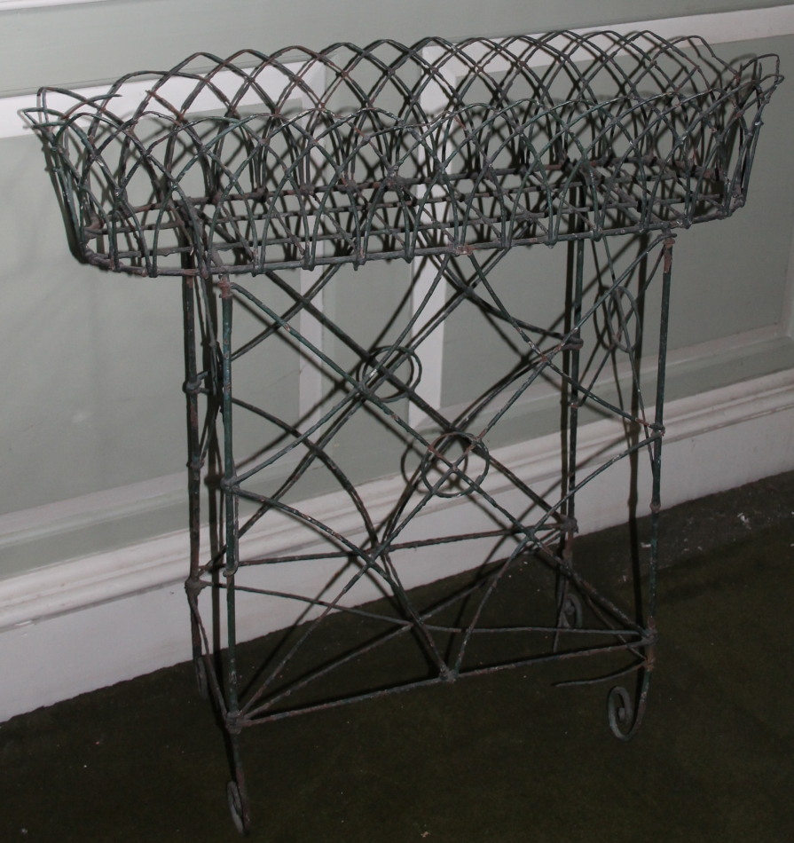 Appraisal: A thC wirework rectangular jardiniere with shaped sides and an