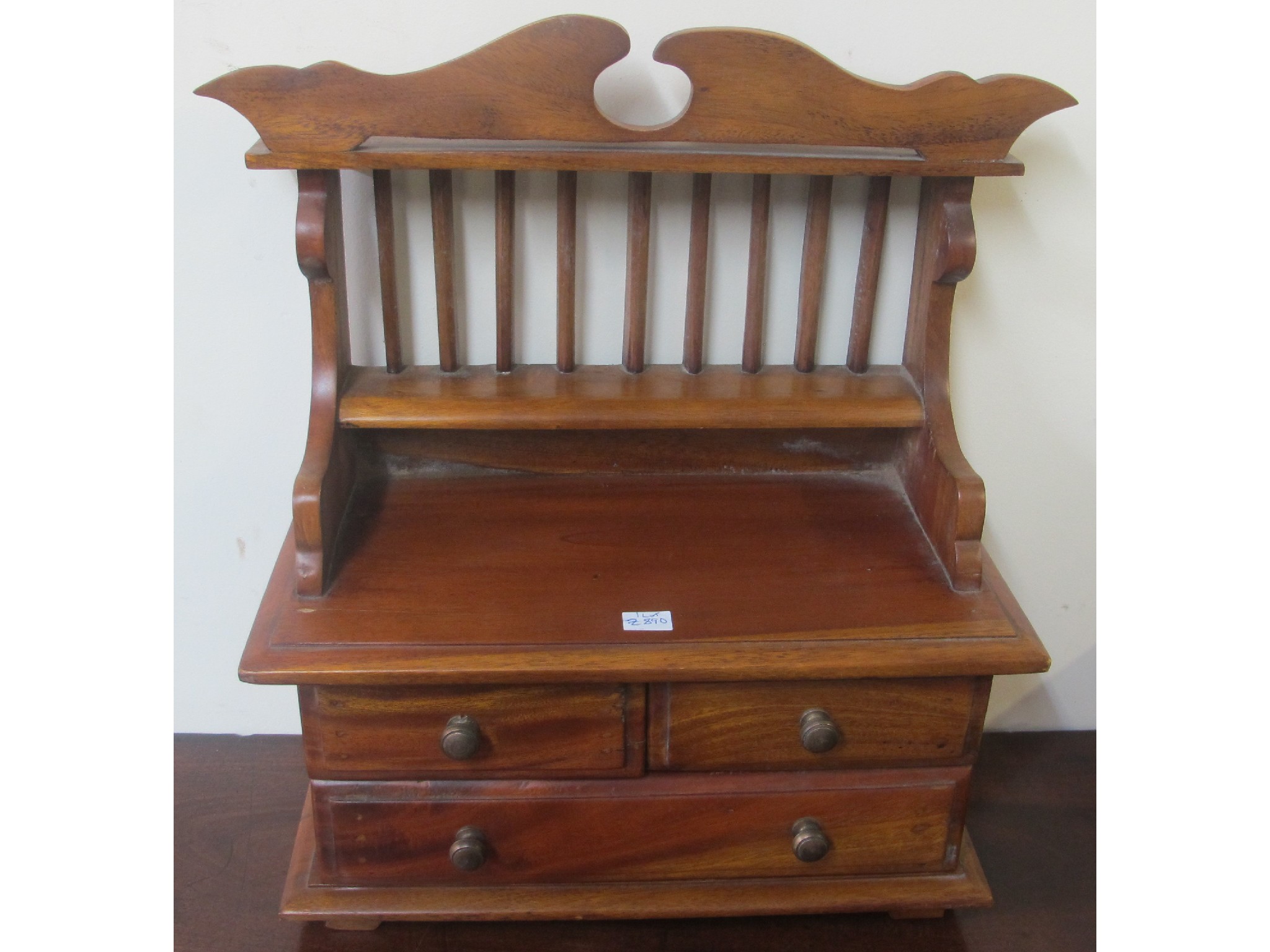 Appraisal: A teak miniature dresser