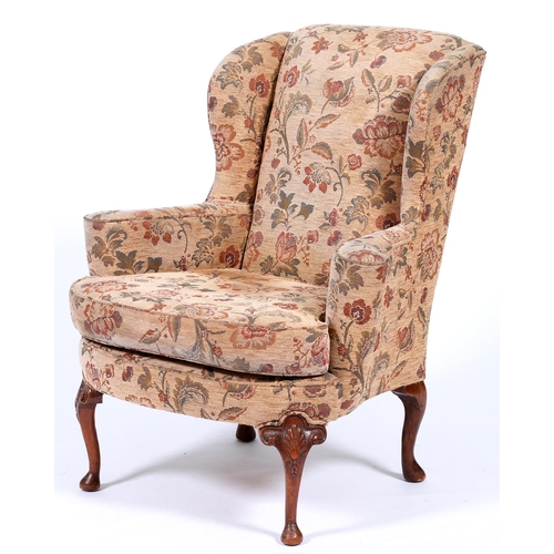 Appraisal: A George II style mahogany framed wingback armchair upholstered in