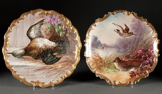 Appraisal: A Two Limoges paint decorated porcelain chargers with images of