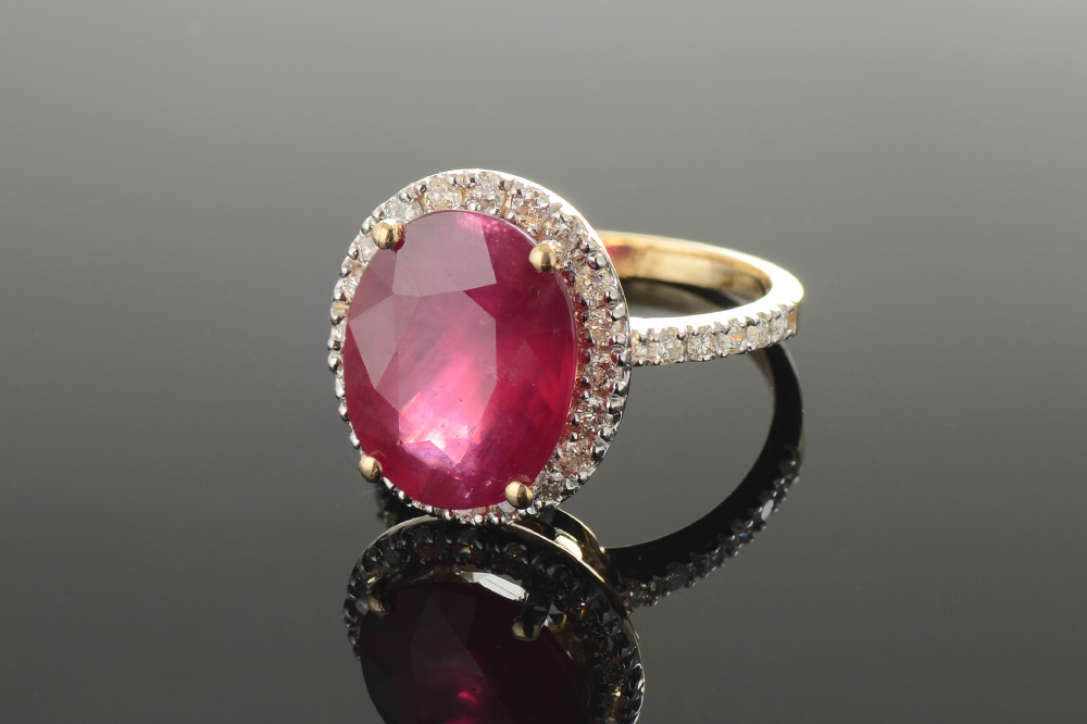 Appraisal: CT RUBY DIAMOND RING k yellow gold ring with a