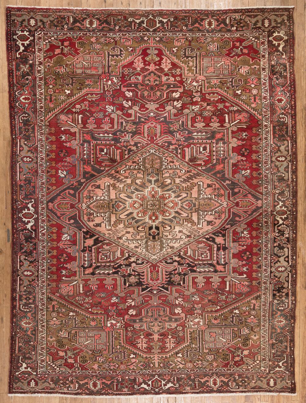 Appraisal: Heriz Carpet red ground central medallion spandrels in light brown