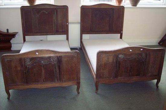 Appraisal: A pair of French th Century beds with panelled carved