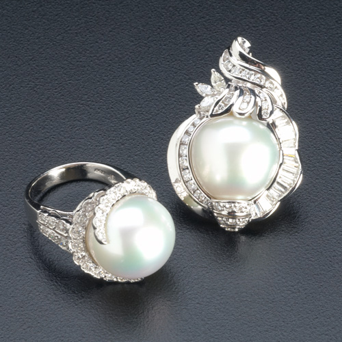 Appraisal: White South Sea pearl and diamond enhancer and ring Enhancer