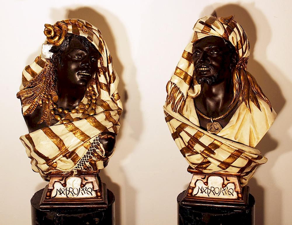 Appraisal: Pair of terracotta busts A pair of terracotta busts of