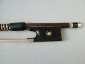 Appraisal: A Silver mounted violin bow Ebony frog inlaid with mother