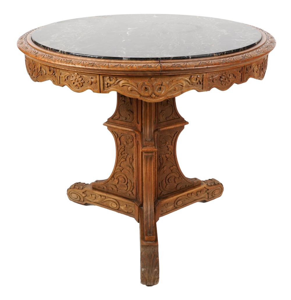 Appraisal: MARBLE-INSET CARVED OAK OCCASIONAL TABLEthe round top on a tripartite