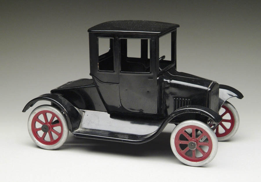 Appraisal: BUDDY L FLIVVER Early black automobile with steerable steel spoked